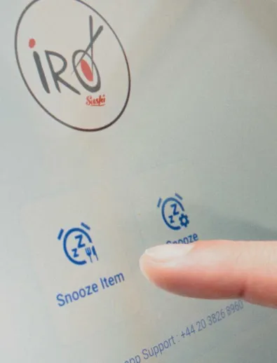 A finger hovering over the Flipdish POS Screen for IRO Sushi