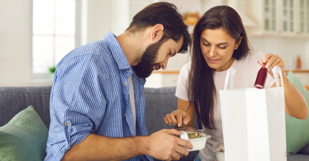 Couple with takeaway food 1024x535