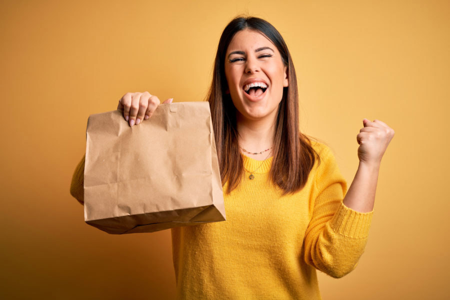 Woman with takeaway bag 1 900x600